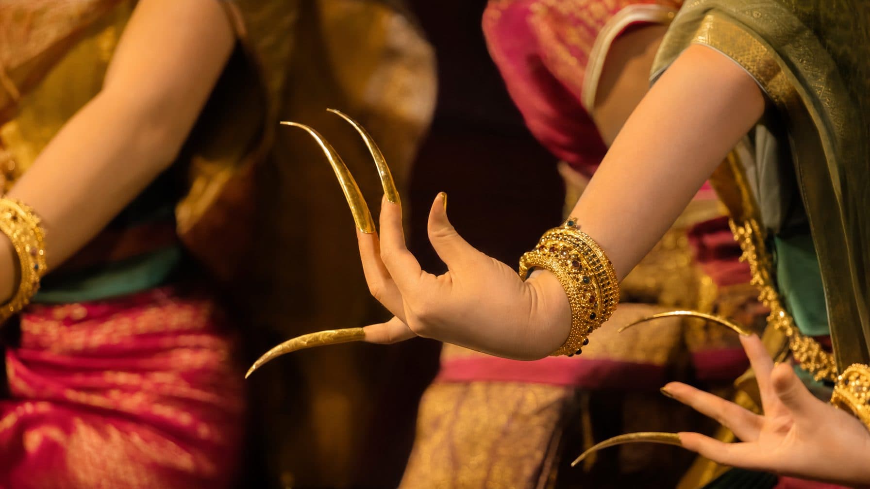 Hands of Thai classical dancers in a traditional Lanna pose
