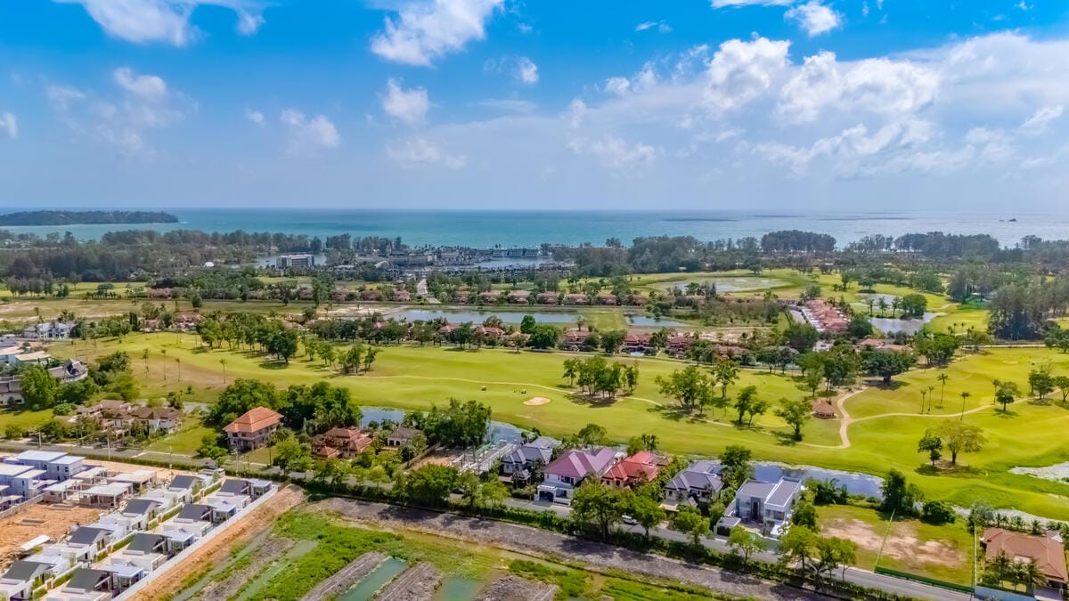 Championship golf course with water features and tropical landscape